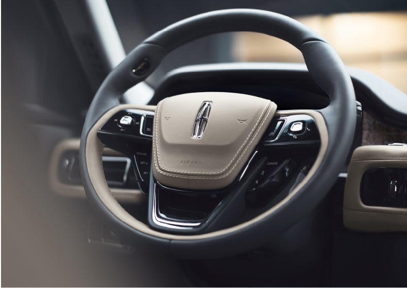 The intuitively placed controls of the steering wheel on a 2023 Lincoln Aviator® SUV | Vision Lincoln in Wahpeton ND