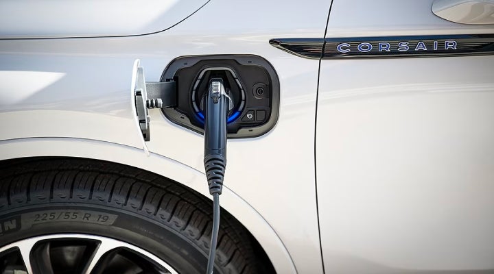 An electric charger is shown plugged into the charging port of a Lincoln Corsair® Grand Touring
model. | Vision Lincoln in Wahpeton ND