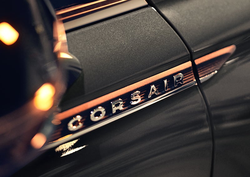 The stylish chrome badge reading “CORSAIR” is shown on the exterior of the vehicle. | Vision Lincoln in Wahpeton ND