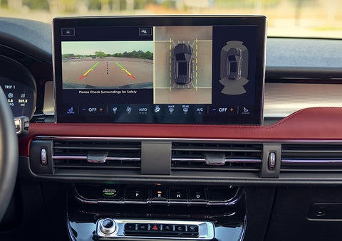 The driver of a 2024 Lincoln Corsair® SUV is shown selecting the drive mode. | Vision Lincoln in Wahpeton ND